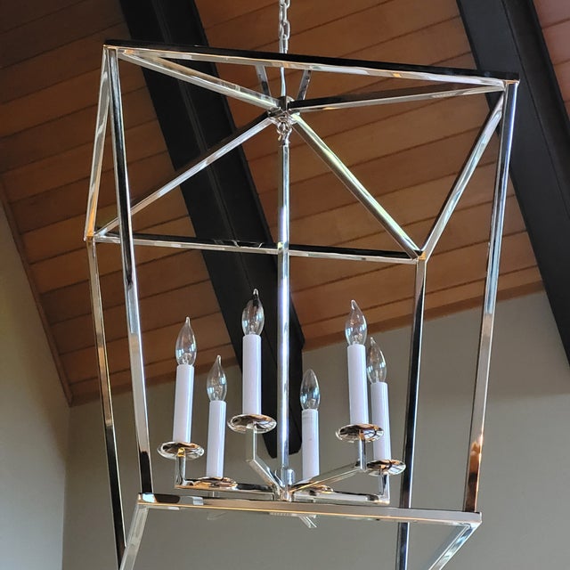 Classic large proportions to the modern geometric structured chandelier - Open steel framework with slightly offset...