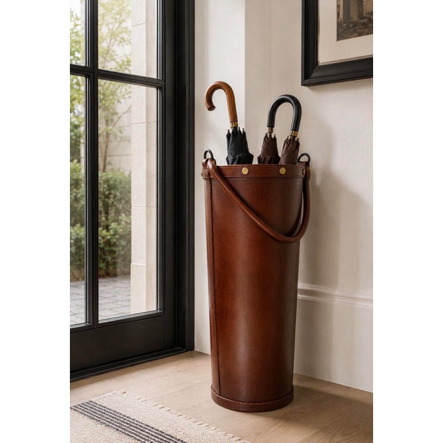 Tall vintage leather umbrella stand with rich equestrian character and classic campaign-style detailing. Beautifully...