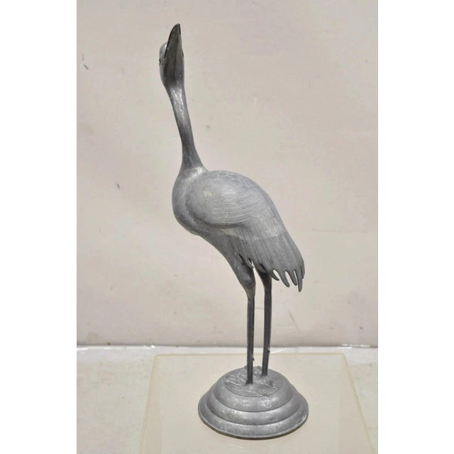 Vintage Hollywood Regency Pewter Metal 27" Crane Bird Statue, Hong Kong. Circa Mid 20th Century. Measurements: 27.5" H x...