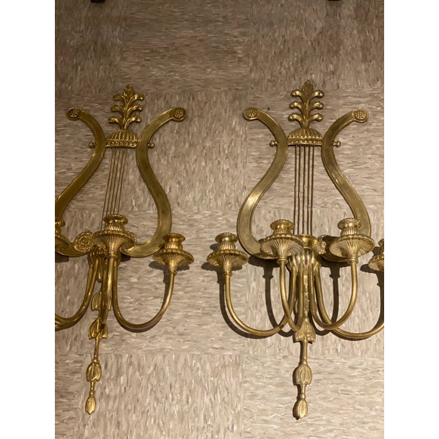 A pair of 1920’s gilt bronze 4 lights sconces lyre design with unusual size