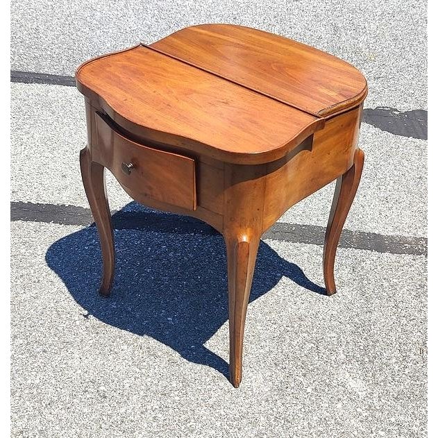 An exquisite Louis XV style walnut side table, this rafraîchissoir—or "refresher/cooler"—harks back to 18th-century French...