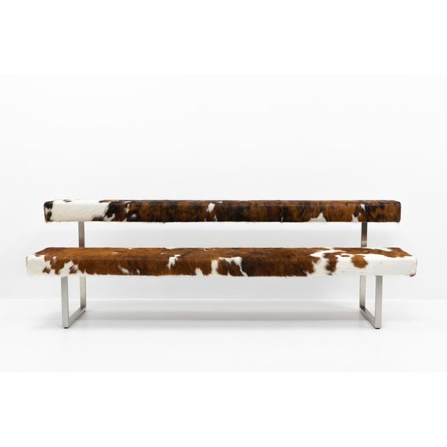 Custom reupholstery by Girsberger, makes this a unique object. Only two benches like this exist. This piece has an...