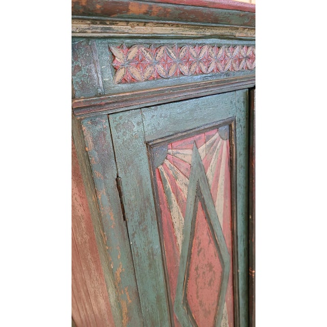This is a striking, memorable vintage storage cabinet with hand carved and painted geometric design. This piece has one...