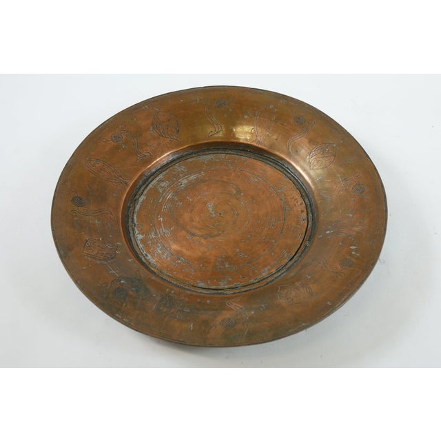 Antique Middle Eastern Copper Tray - 16.5” x 16.5” x 2” This exquisite antique Middle Eastern copper tray, measuring 16.5...