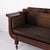 Antique empire sofa from the 1830s, crafted in mahogany with turned legs and brown upholstery. The sofa has a classic...