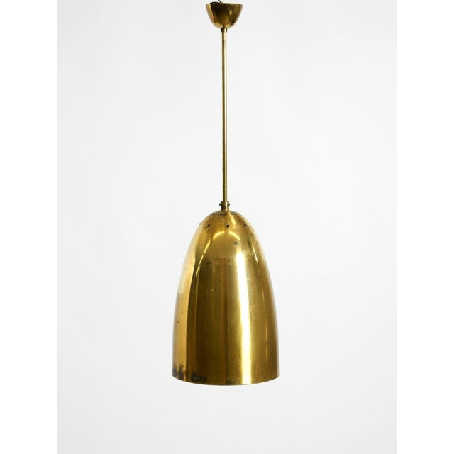 Beautiful, rare, large, original Mid-Century Modern brass pendant lamp. The large shade, rod, canopy, and socket are made...