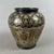 This refined piece represents an example of excellence in Asian artistic craftsmanship in hand-crafted metalwork. The vase...