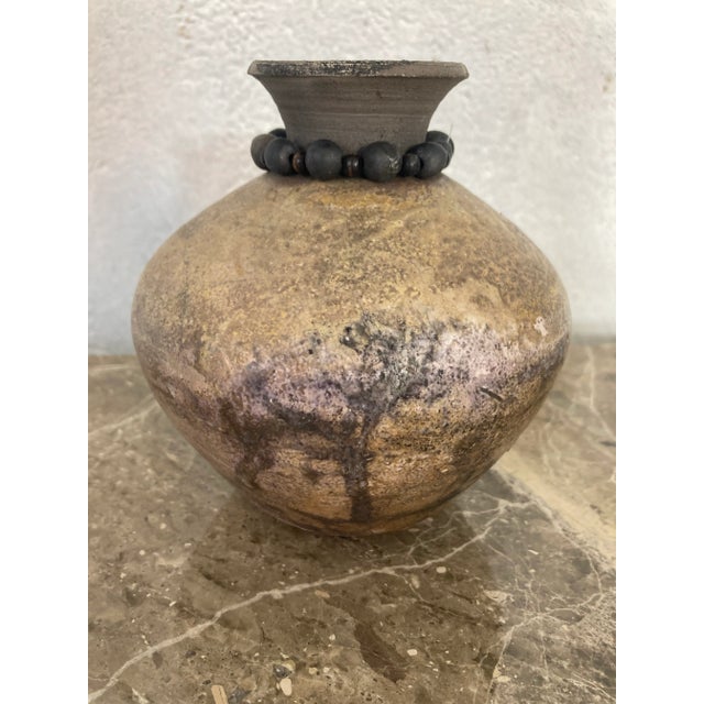 Chic and understated, this studio pottery piece has a great look! Beaded trim, signed