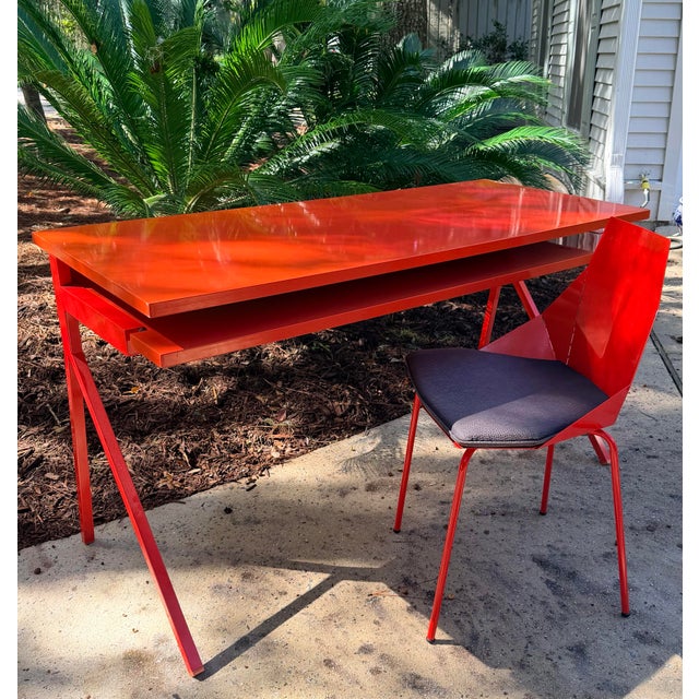 Sleek red lacquered powder coated computer desk with matching chair in great preowned condition. This desk was highlighted...