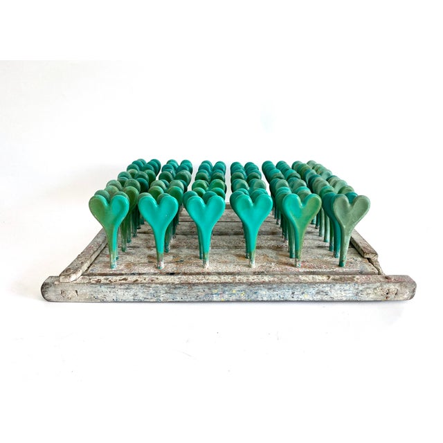 A unique piece of industrial salvage with green heart shaped spindles, this sculptural vintage balloon mold with plastic...