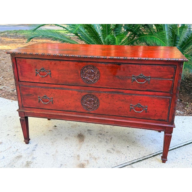 Exceptional Maitland Smith red-painted, two-drawer commode or chest of drawers designed in a neoclassical or French...