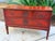 Exceptional Maitland Smith red-painted, two-drawer commode or chest of drawers designed in a neoclassical or French...