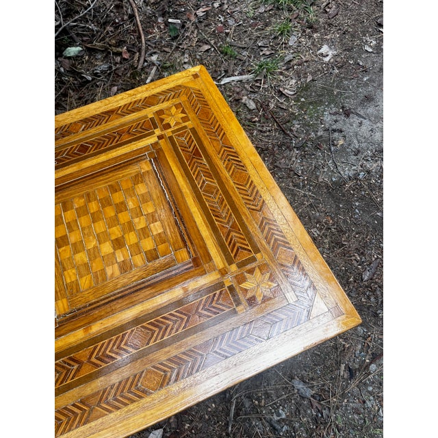 This is an incredibly unique table, with true craftsmanship. It is an antique with primitive and folk Inlay & Marquetry...