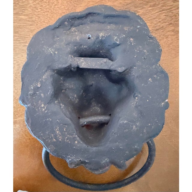 Old cast metal lion head door knocker, eclectic decorative accessory. Heavy and old with wonderful patina. Measures 12"...
