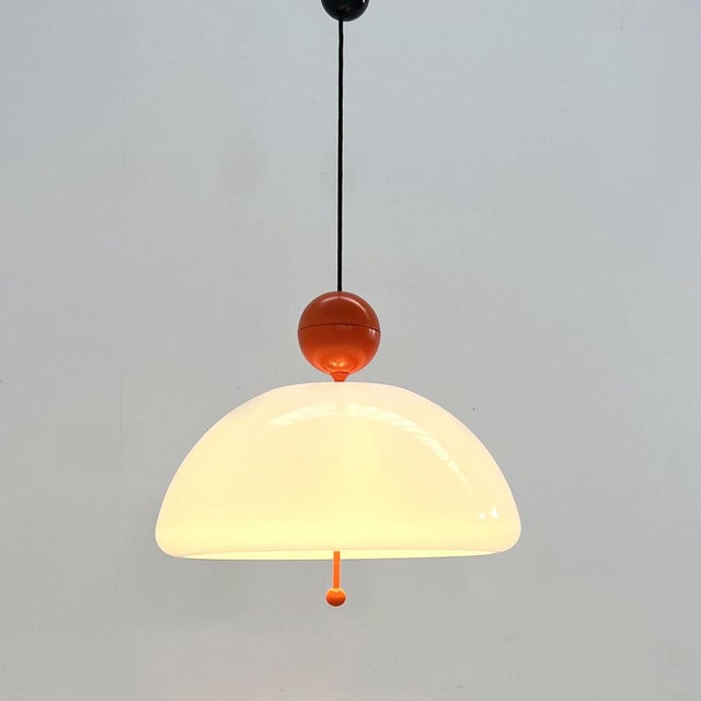 Orange Saliscendi Pendant Light attributed to Elio Martinelli for Martinelli Luce, 1970s, in Good conditions. Designed...