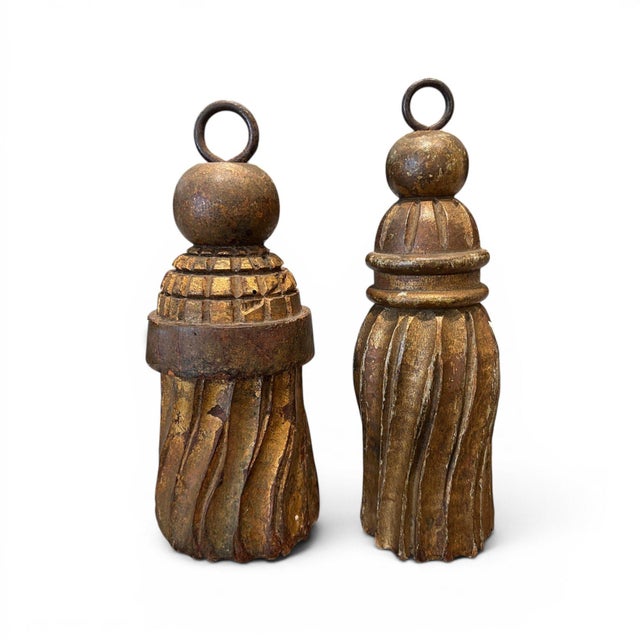 A charming pair of 19th century Italian carved wooden tassels featuring beautiful hand-crafted detail and a rich, timeworn...