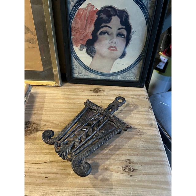 Up for consideration is a beautiful vintage small cast iron trivet. This would look lovely in your home and it is a...