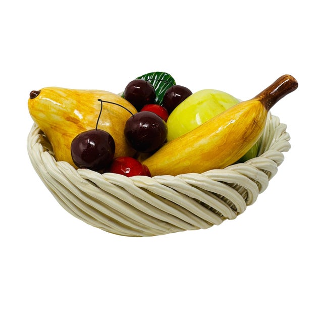 A charming and vibrant example of Italian ceramic artistry, this vintage majolica-style fruit basket is a quintessential...
