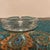 This classic Mid-Century Modern advertising ashtray is a beautifully preserved piece of 1960s hospitality memorabilia....