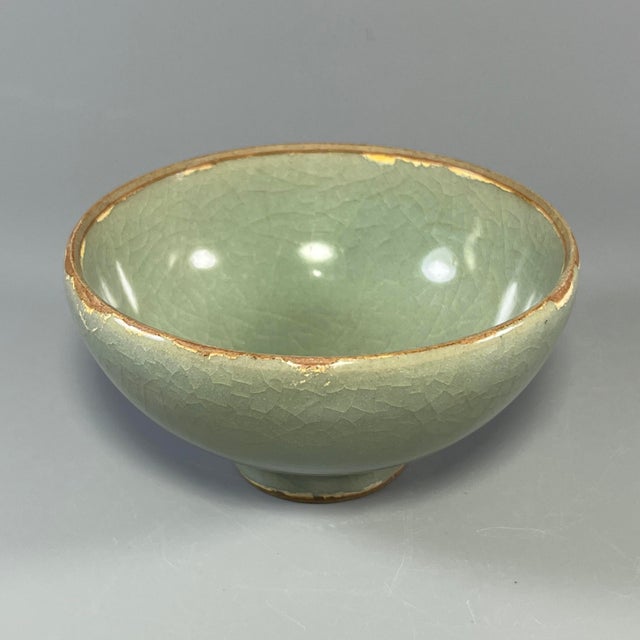 Classic Chinese celadon bowl covered with beautiful natural crackle glaze. Soft pale green tone, neat rounded shape, ideal...