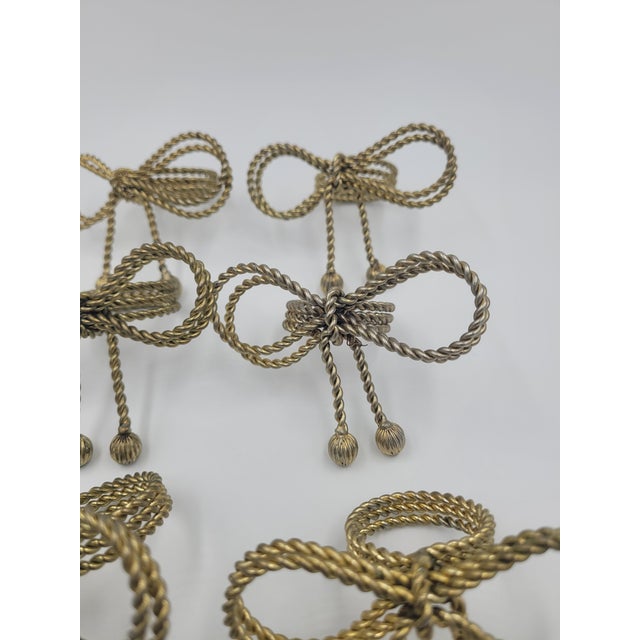 Hollywood Regency Late 20th Century Hollywood Regency Gold-Tone Metal Rope Bow Napkin Rings - Set of 8 For Sale - Image 3 of 12