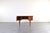 This teak desk was manufactured in Denmark in the 1960s and exemplifies the Mid-Century Modern style, which emphasized...