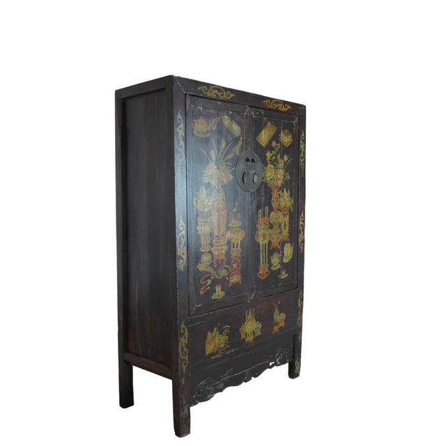 The two panel doors of this black Chinese Chinoiserie cabinet are adorn with hand painted flowers and flying butterfly and...