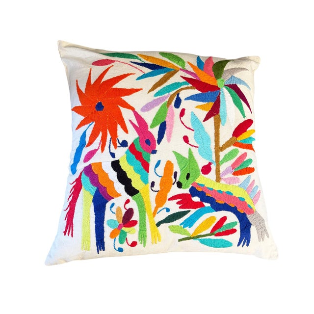 An exceptional example of Mexican Otomi embroidery textile pillow features meticulously hand-stitched imagery of a two...