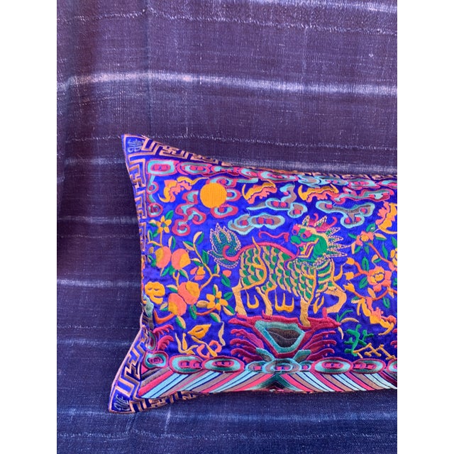 Boudoir lumbar pillow made of a vintage colorful embroidered silk Asian textile fragment from a Chinese Opera Robe. A...