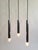 Set of three Space Age STAFF pendant lights, designed by Motoko Ishii in the 1970s, forming a cascade. Each set consists...