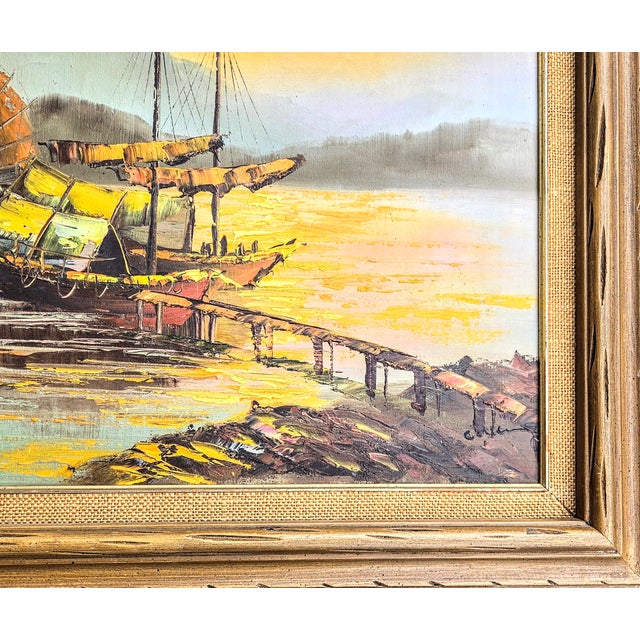 A fiery golden sunset tops a harbor full of Chinese Junk ships in this mid century oil painting. The detail and texture is...