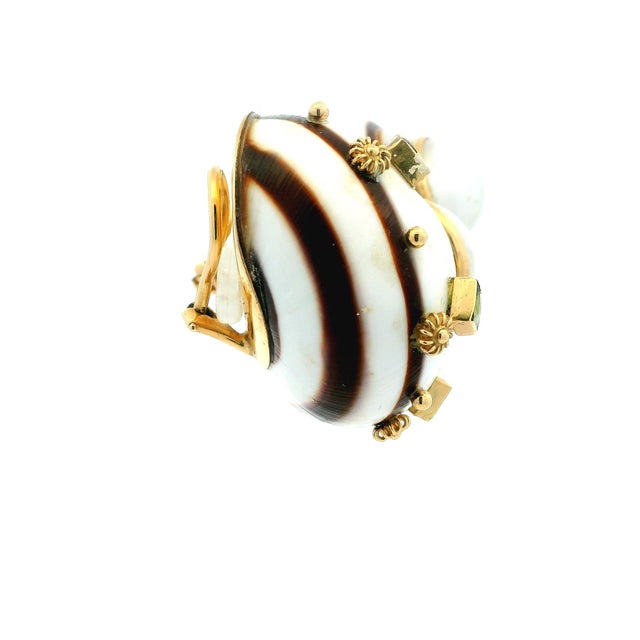 Bold sculptural clip earrings by American maker MAZ, dating to circa 1970. Crafted in 14K yellow gold, each earring...