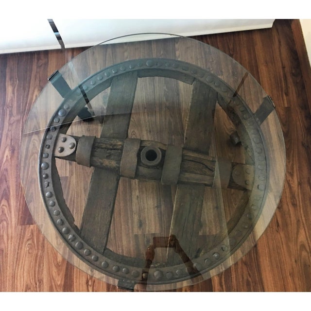 Brown Wooden Wagon Wheel Indutrial Accent Spanish Table With Glass Top For Sale - Image 8 of 11