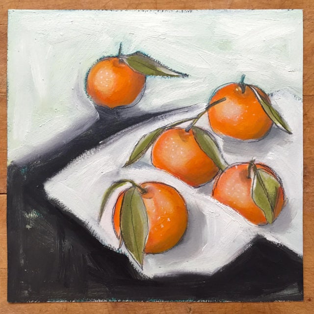 An unframed oil and graphite on archival paper still life painting of tangelos. Painted by Lara Felsing.