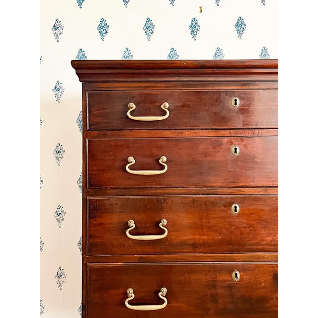 This handsome tall chest was once the top part of a high boy or chest on chest, but it was separated from its base. A...