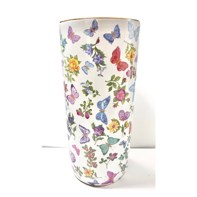 Charming vintage ceramic floor vase umbrella stand featuring an allover butterfly and botanical motif, accented with a...