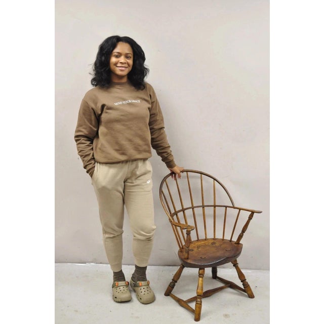 Antique French Country Colonial Chestnut Oak Wood Small Bowed Windsor Arm Chair. Item features a unique cat eye shaped...