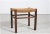 Wabi Sabi stool made in Scandinavian in the 1950s. The frame is made of solid dark stained wood with seat of plaited cord...