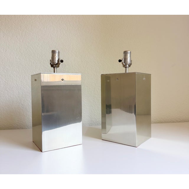 A pair of brushed aluminum table lamps attributed to legendary London-based mid-century modern design boutique "Habitat",...