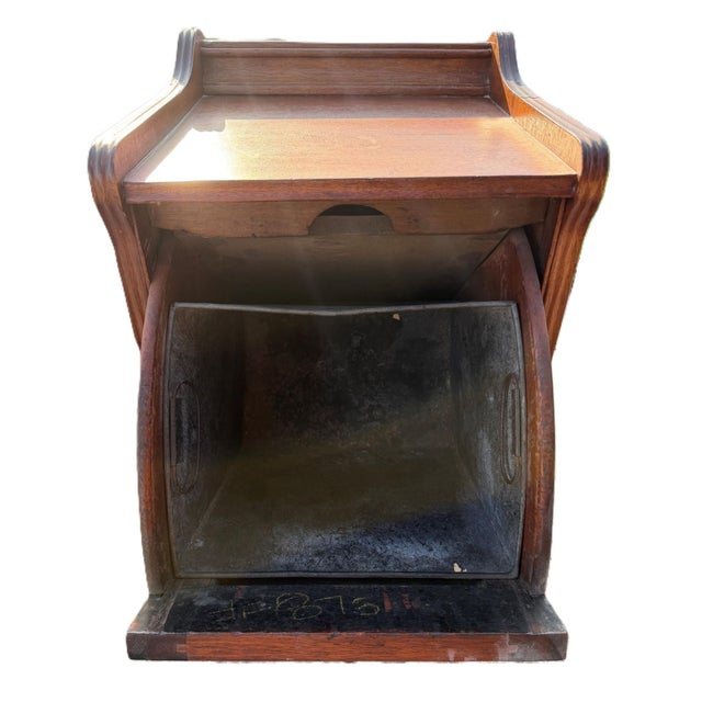 This antique 19th century hand-carved Victorian mahogany coal purdonium box with original metal liner and casters features...