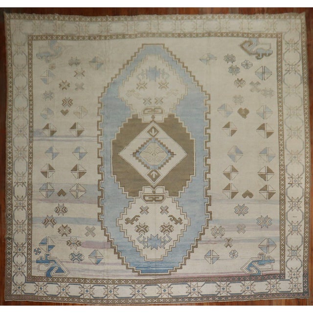 A Mid-20th Century Turkish Rug in predominantly white and blue. Measures: 13'' x 15'.