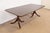 An exceptional Georgian or Regency style double pedestal extension dining table In the manner of Baker Furniture USA,...
