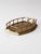 A striking mid-century brass gallery tray featuring a sculptural openwork rail and integrated handles. Its warm brass...