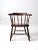 This is a stunning antique wooden captain's chair. The classic barrel style chair features a spindle back with a plank...