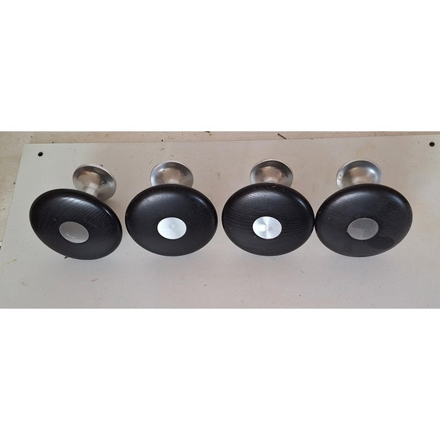 Vintage Coat Hooks with Metal Brackets and Black Stained Oak Plates, 1970s, Set of 4, in Very Good conditions. Designed...