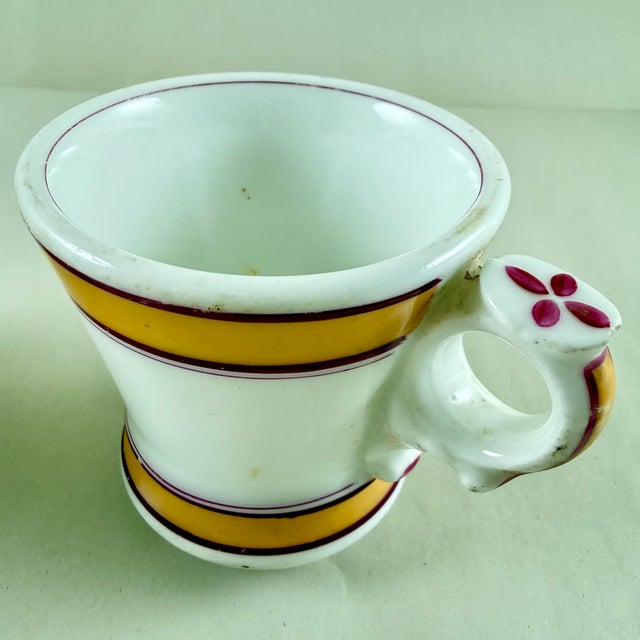 A pair of French brûlot cups, dating to the Belle Epoque Era, circa early 1900s. These thick-walled sturdy porcelain cups...