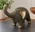 Striking vintage wood elephant sculpture featuring an unusual geometric carved design with contrasting dark recessed lines...