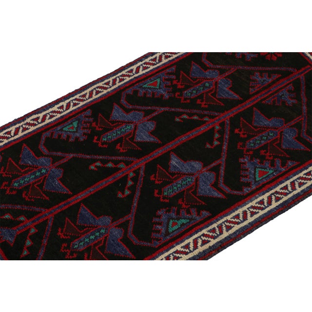 Hand knotted in wool, this 6x8 Baluch rug represents a new line of tribal carpets in the Modern Classics Collection by Rug...