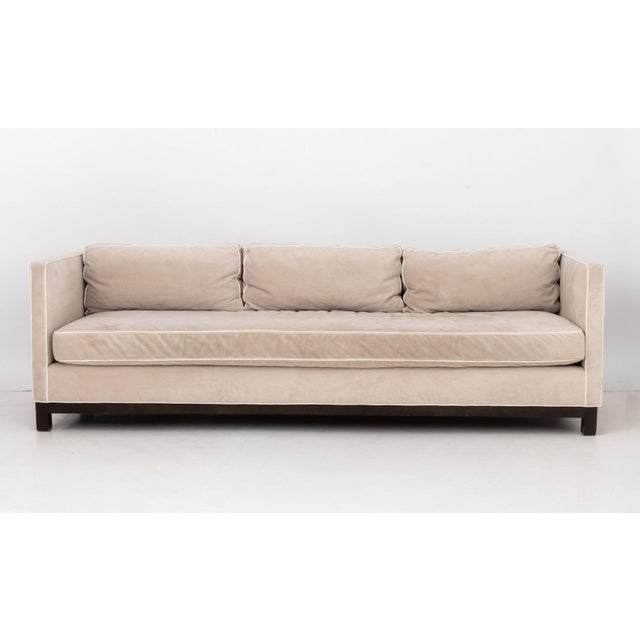 Mitchell Gold and Bob William Beige Velvet Upholstered Three-Seat Sofa, with three cushions and white trim, with "Mitchell...