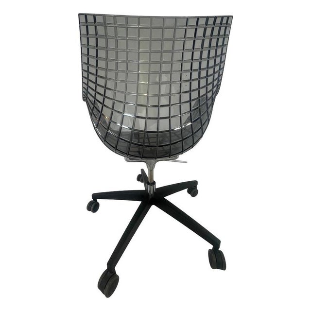 Iconic chair by Christophe Pillet for Driade. The design is based on the lines that run on the longitude and latitude on...